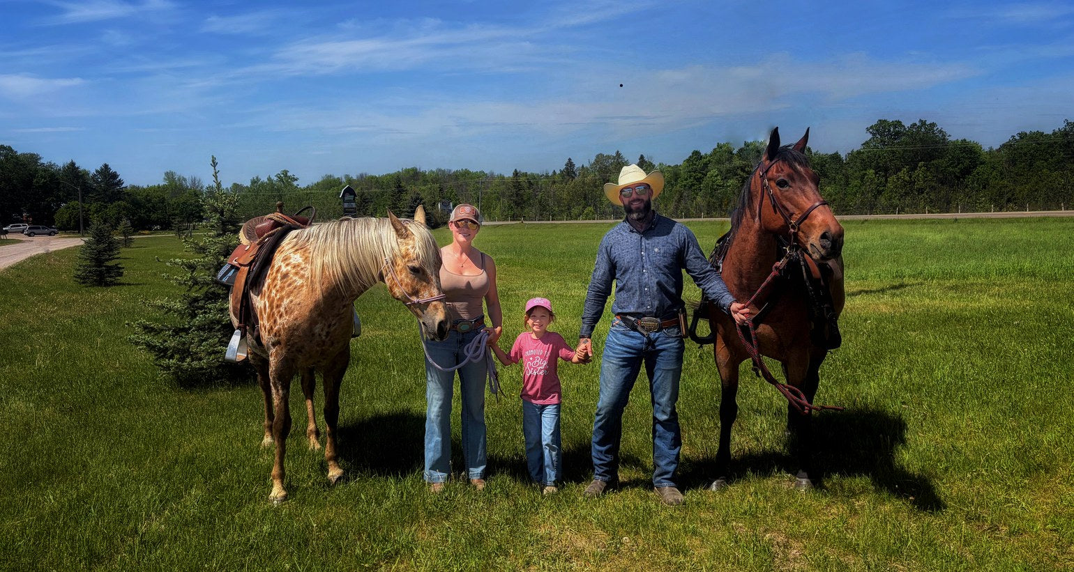 North Spur family with horses in a field