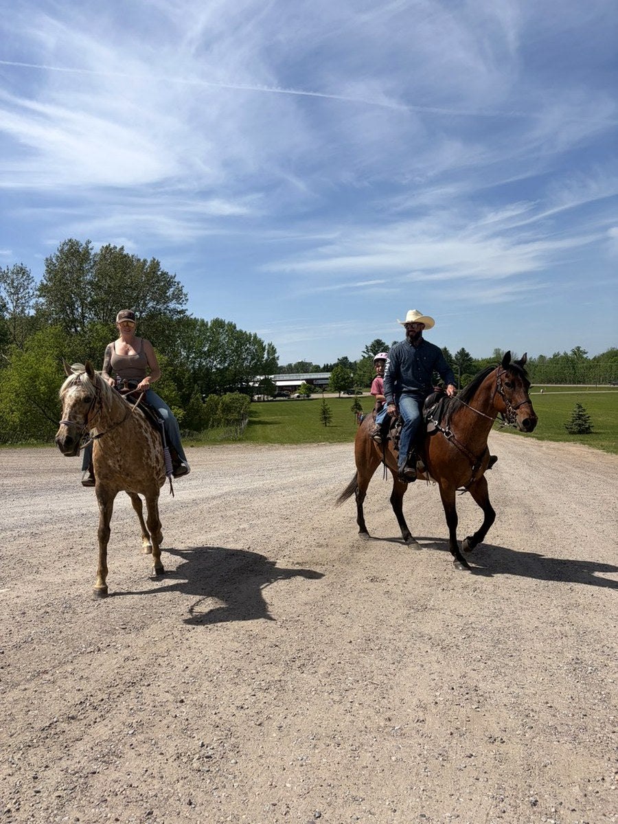 North Spur horses and family riding together